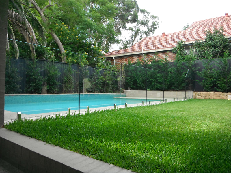 Frameless glass pool fencing fixed with stainless steel spigots.